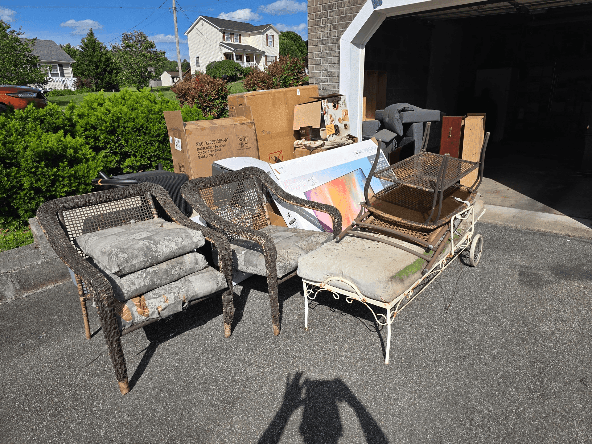 Outdoor furniture and household items being cleared during an estate cleanout