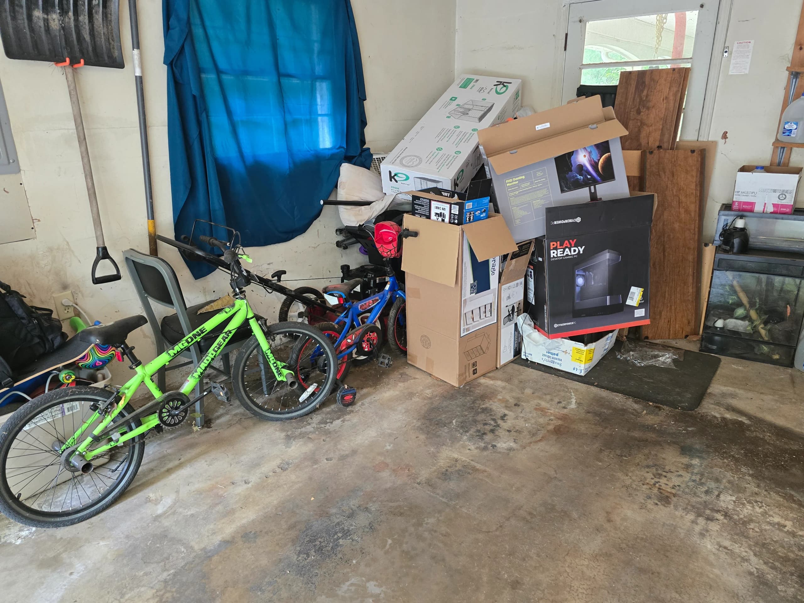 Garage clutter staged for cleanout by Kraken Junk Removal
