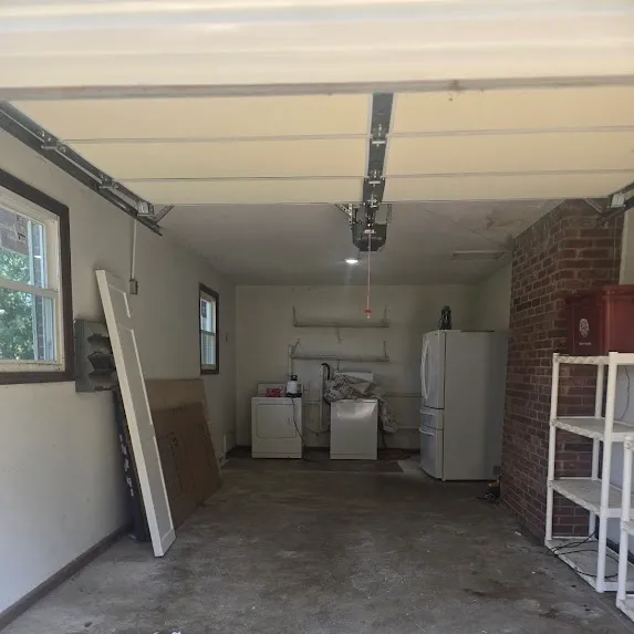 Cleared garage floor after cleanout by Kraken Junk Removal