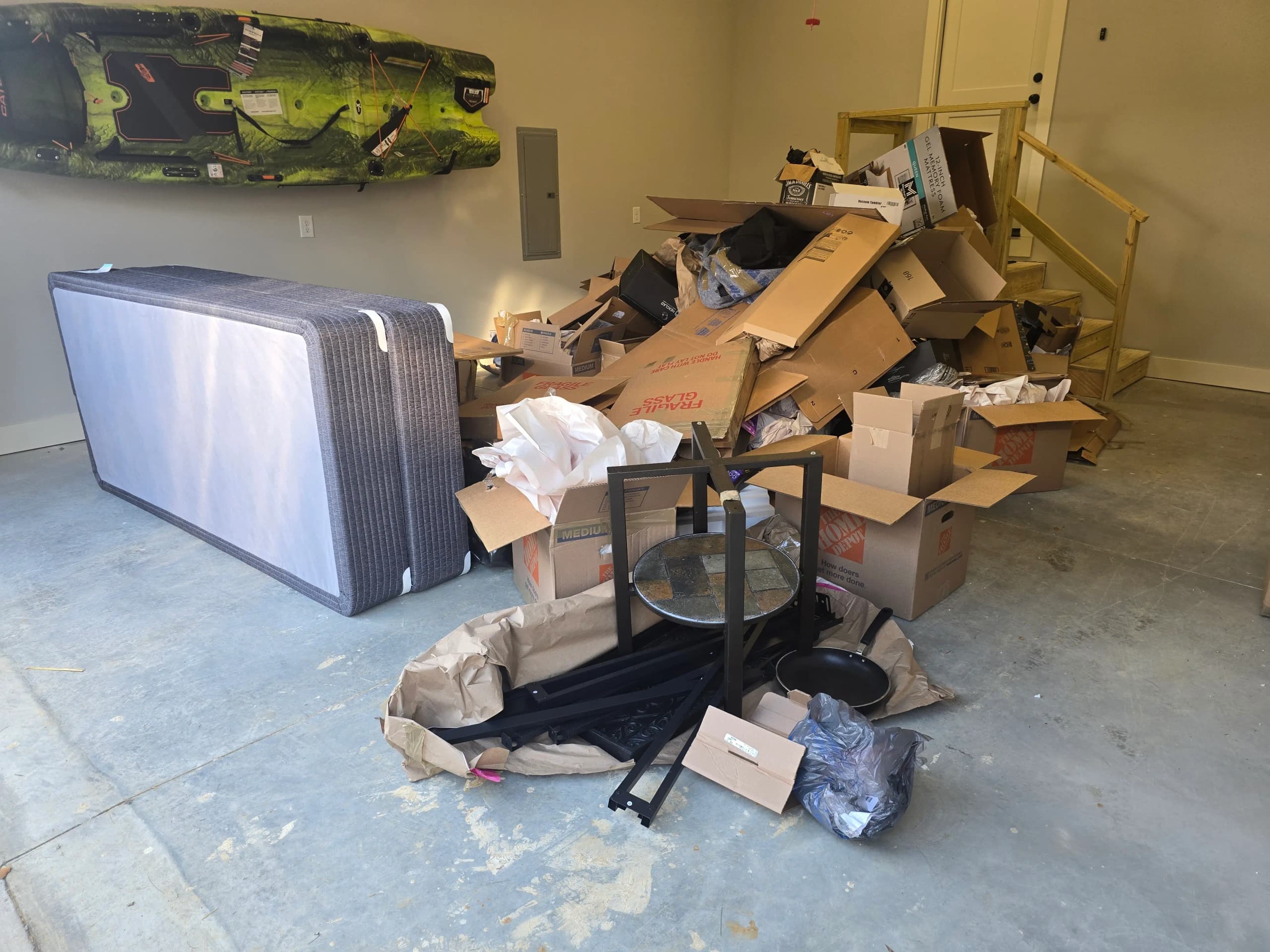 Garage clutter staged for cleanout by Kraken Junk Removal