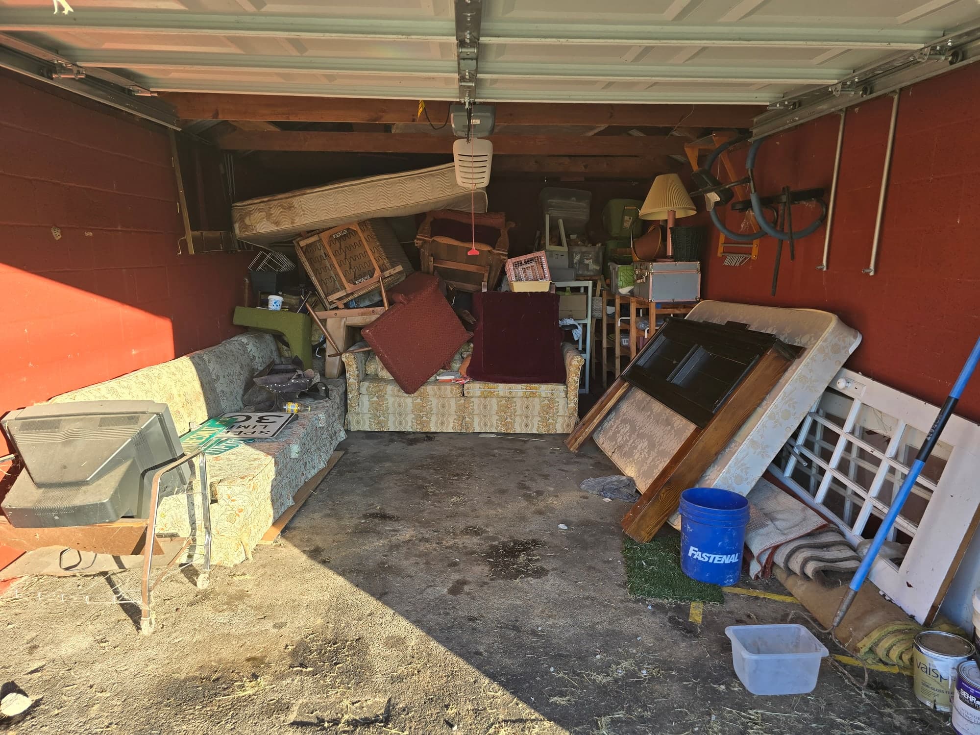 Cluttered garage before a cleanout in Johnson City, TN