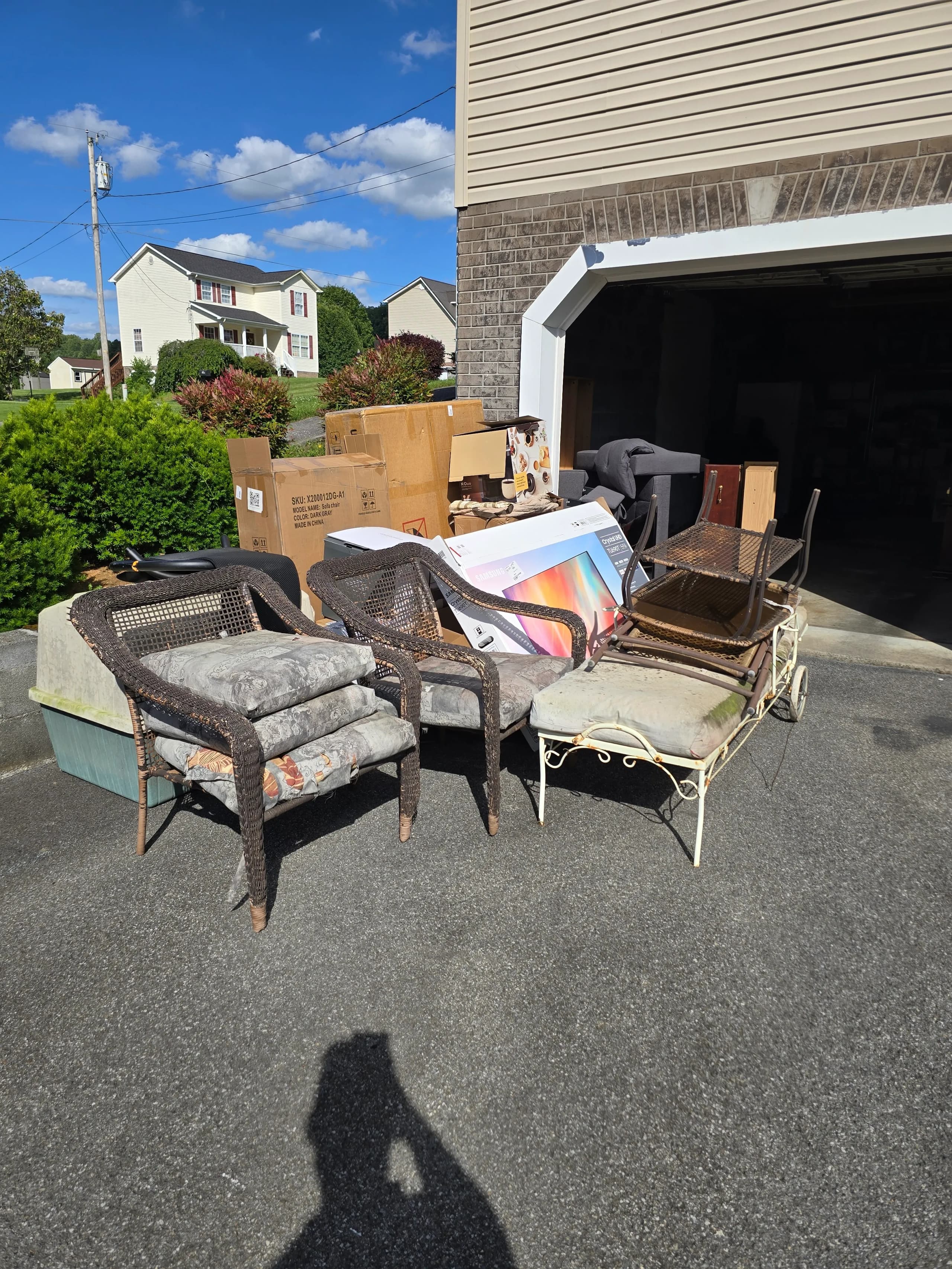 Junk furniture staged for removal by Kraken Junk Removal