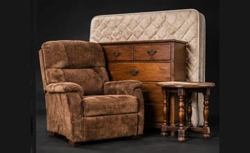 Upholstered recliner, wooden dresser, mattress, and small side table