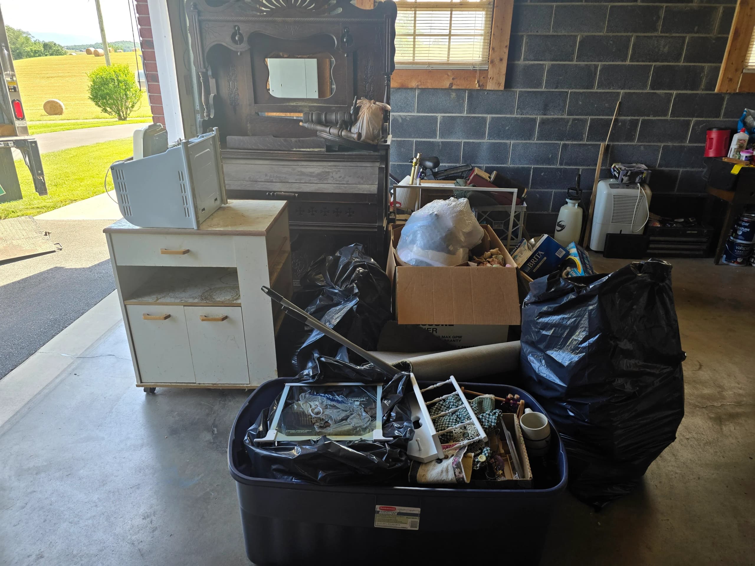 Cluttered garage before cleanout by Kraken Junk Removal