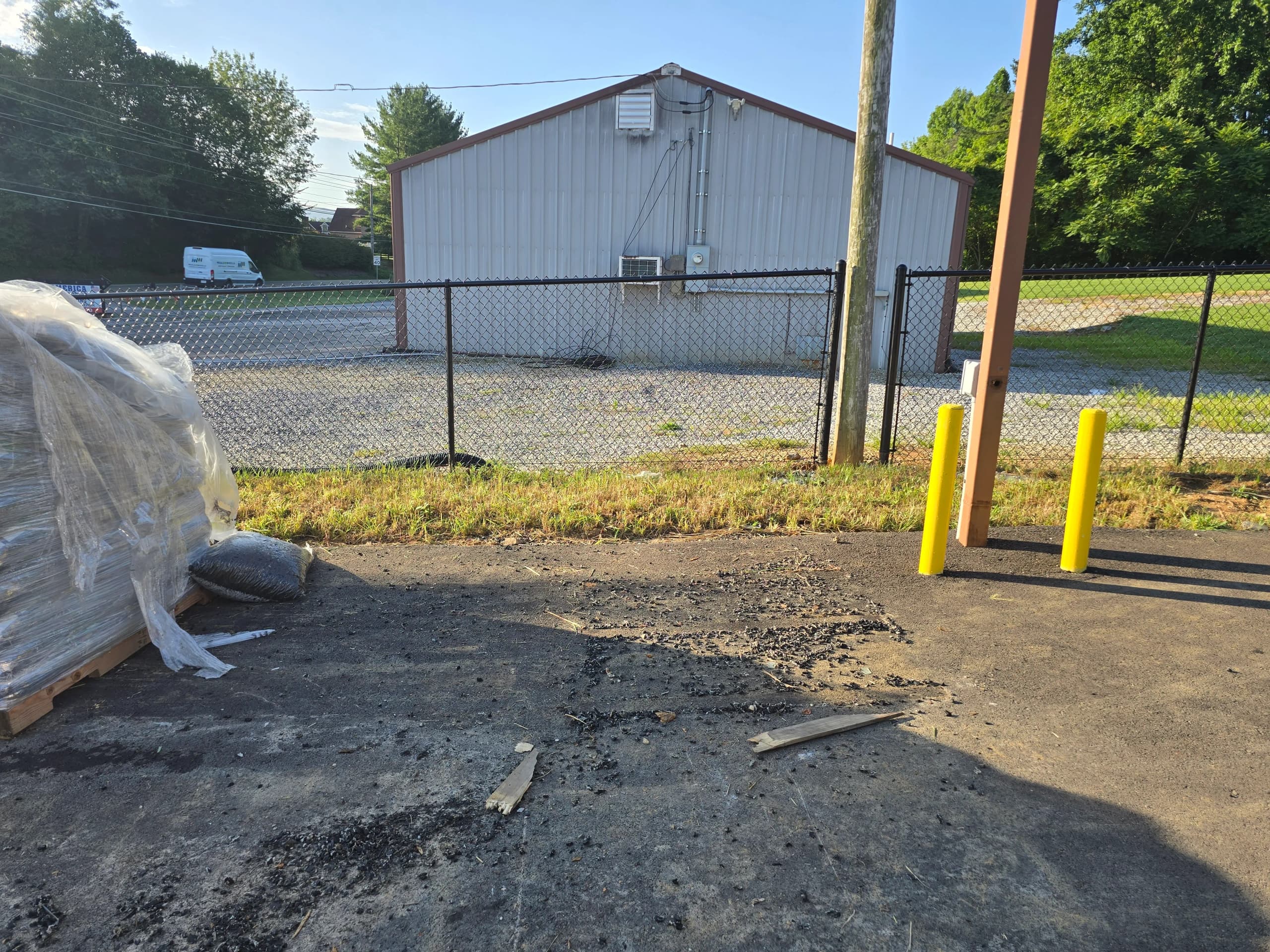 Cleared paved lot after construction debris removal by Kraken Junk Removal