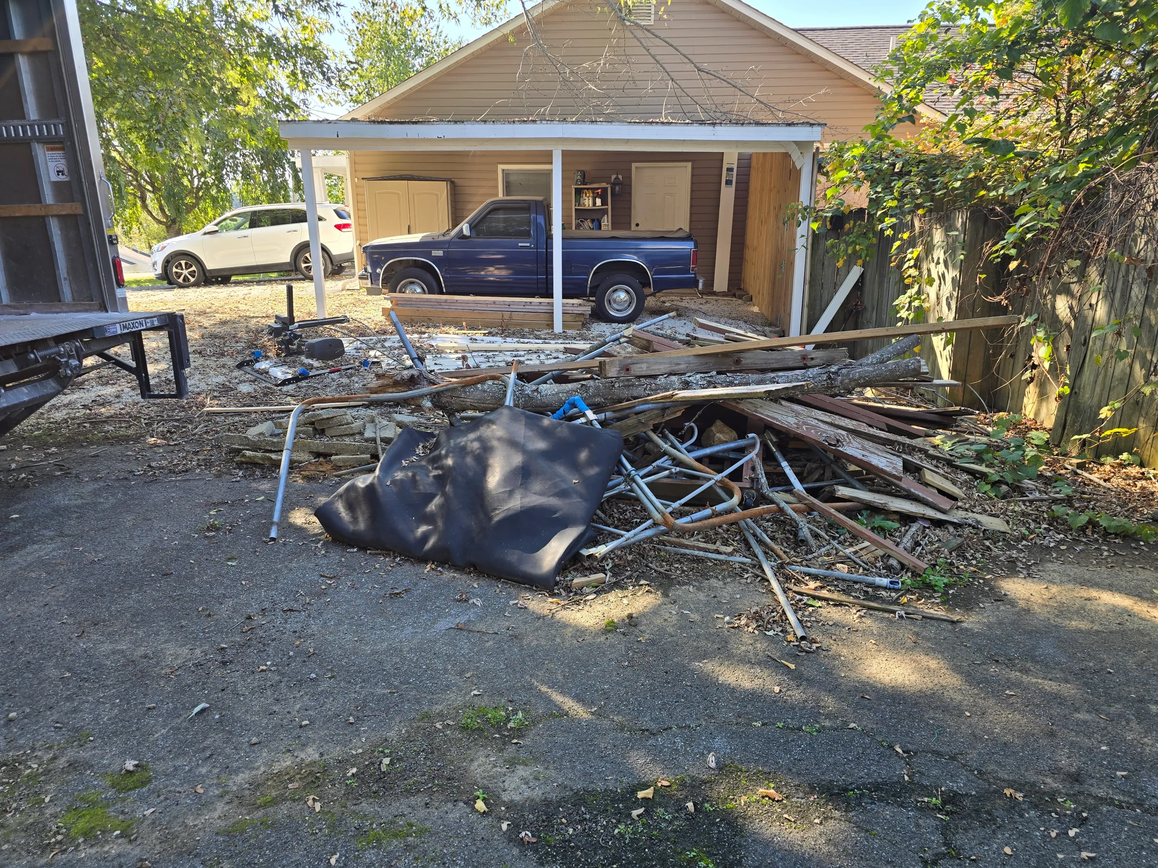 Construction debris staged for removal by Kraken Junk Removal