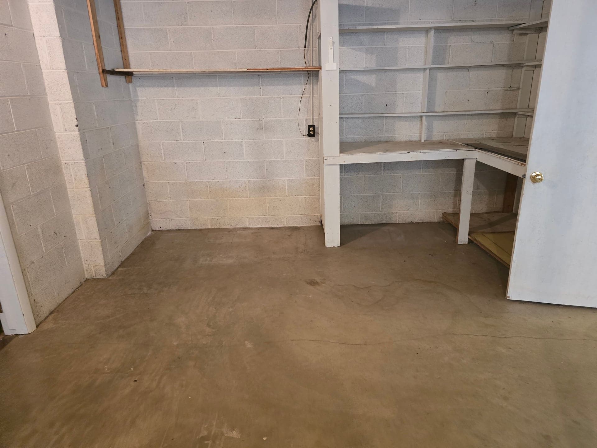 Cleared floor space after furniture removal by Kraken Junk Removal