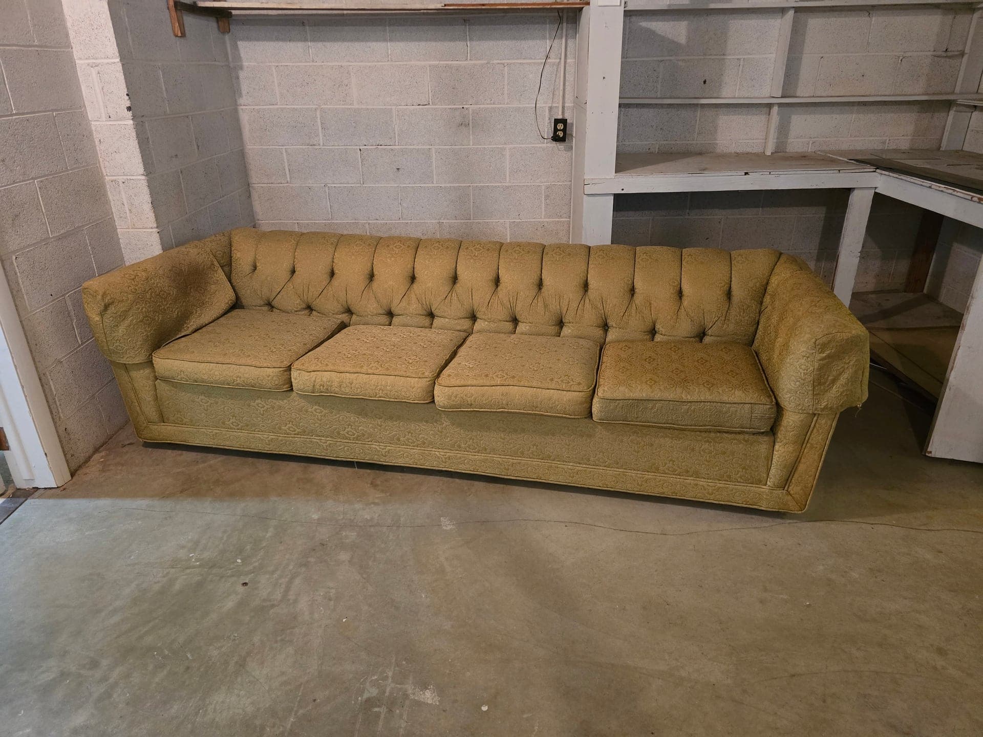 Couch staged for furniture removal by Kraken Junk Removal