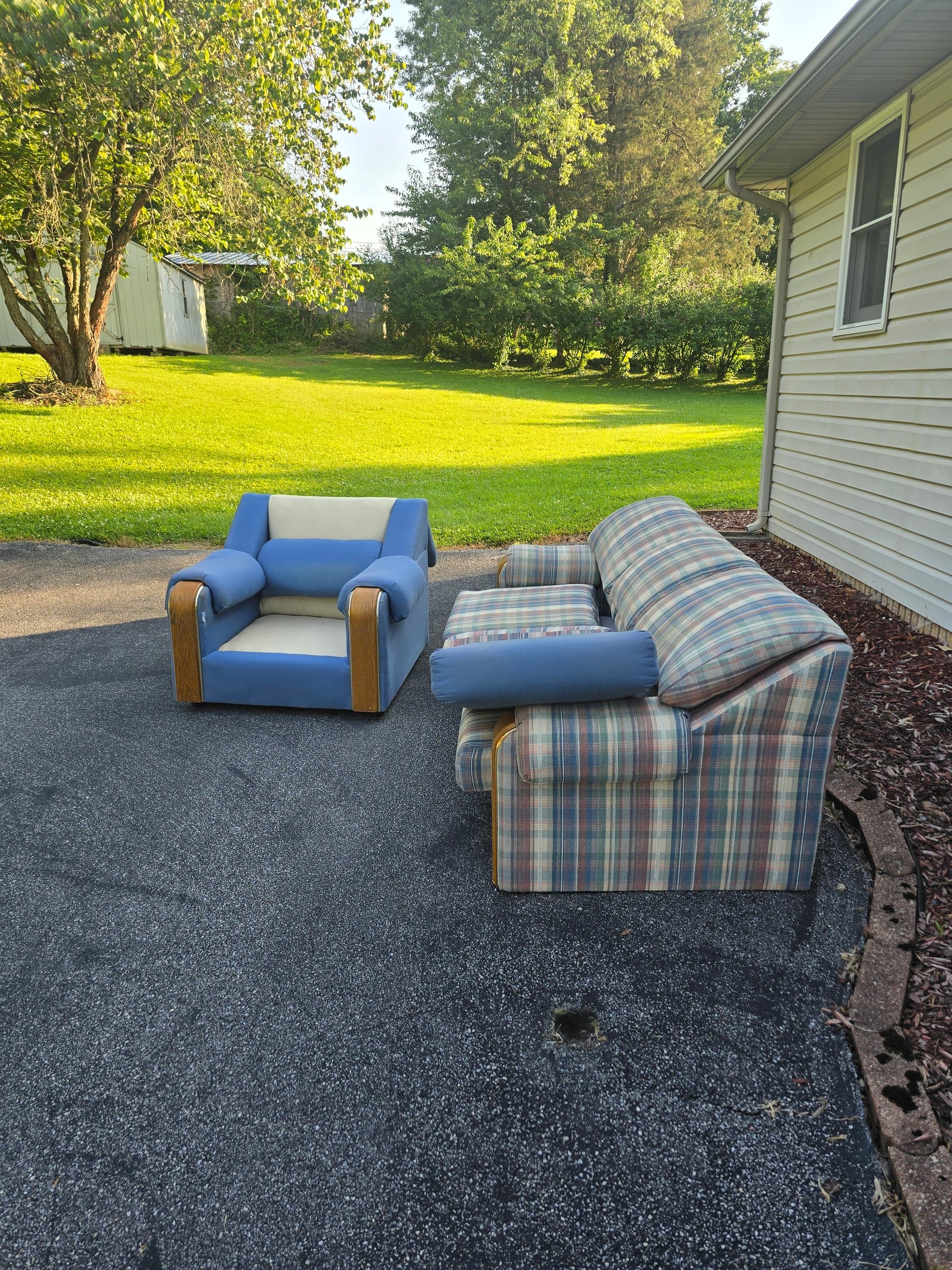 Sofa and armchair staged for furniture removal in Johnson City, TN