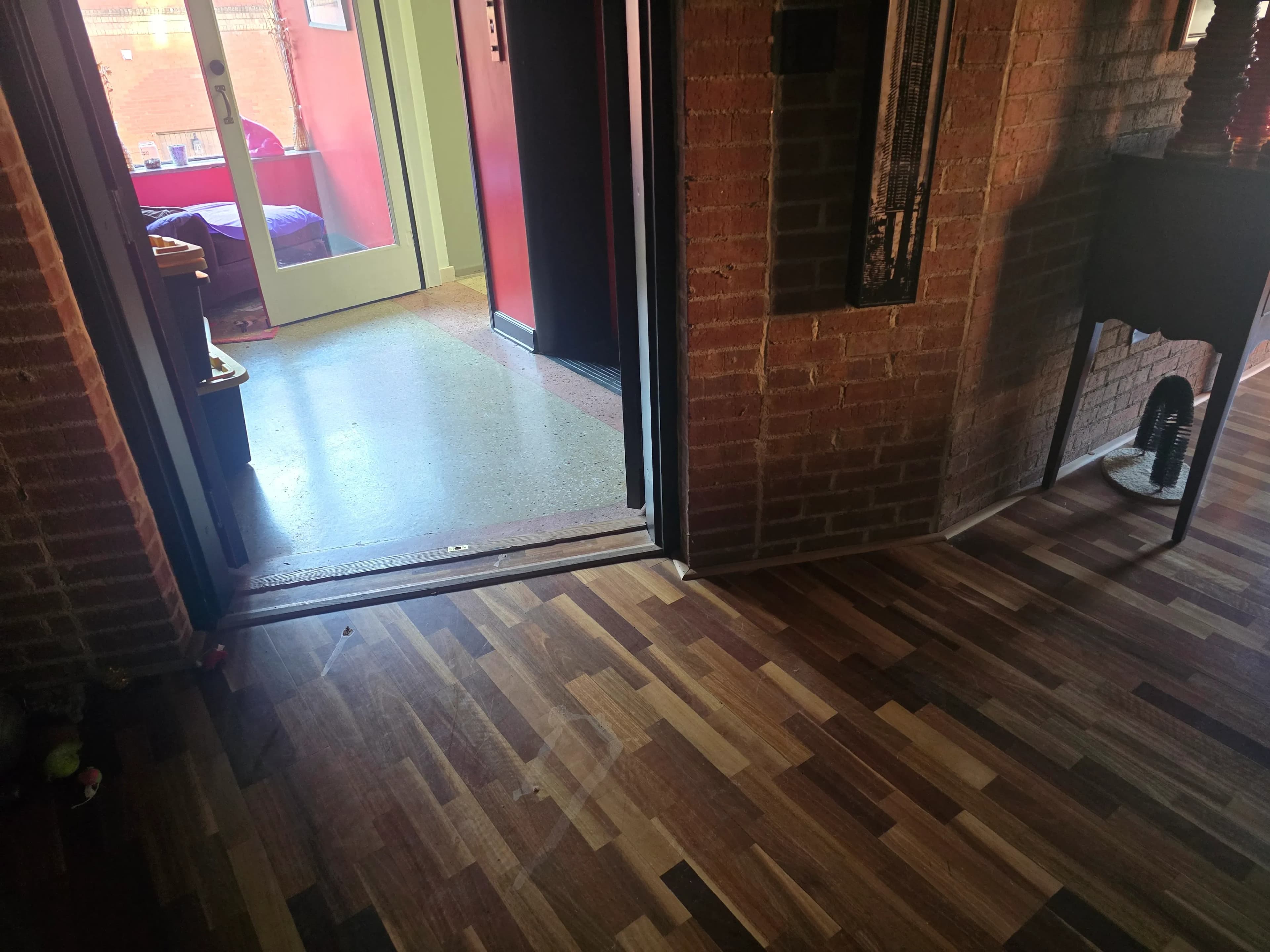 Cleared floor after furniture removal by Kraken Junk Removal