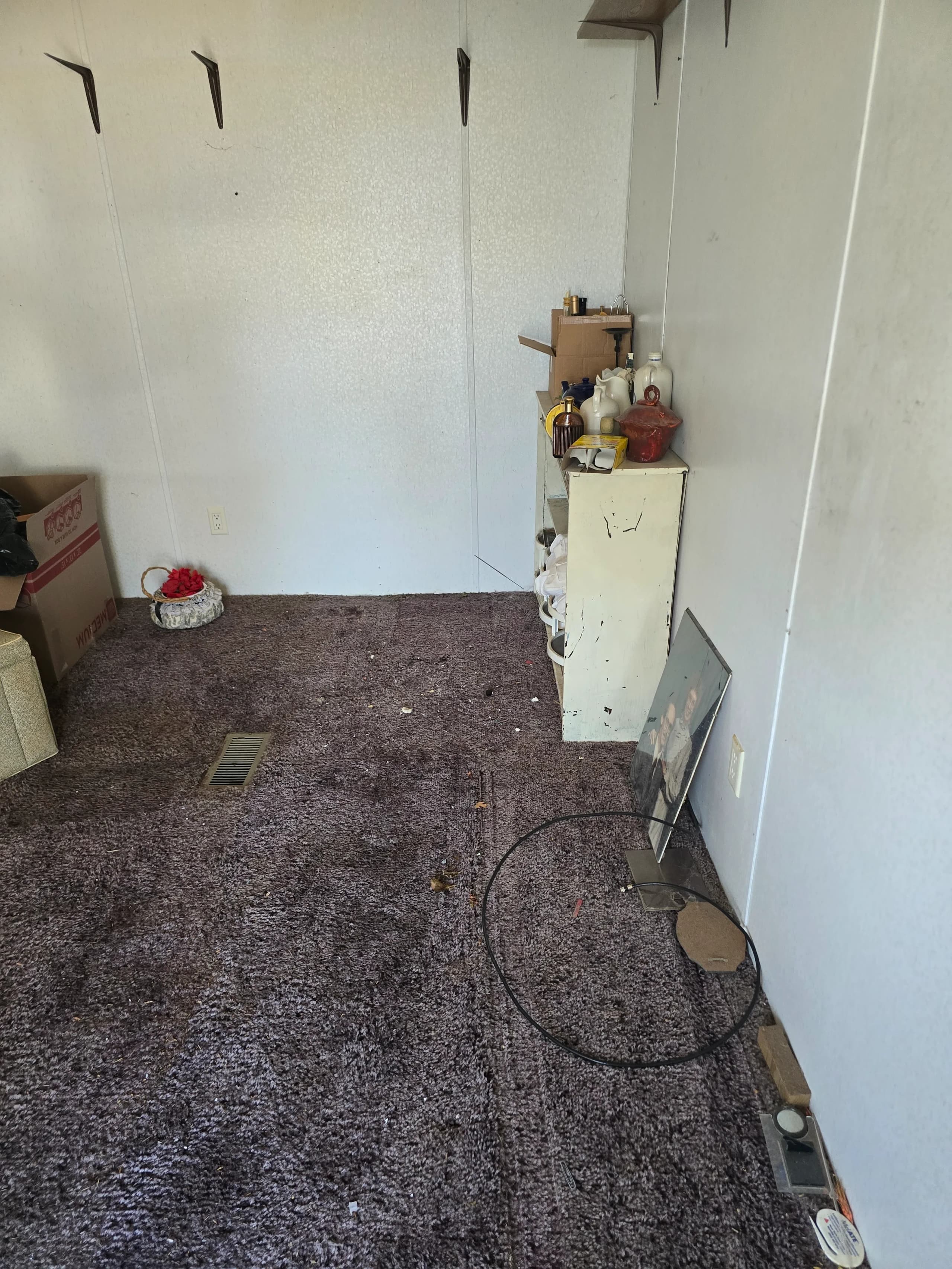 Cleared space after furniture removal by Kraken Junk Removal