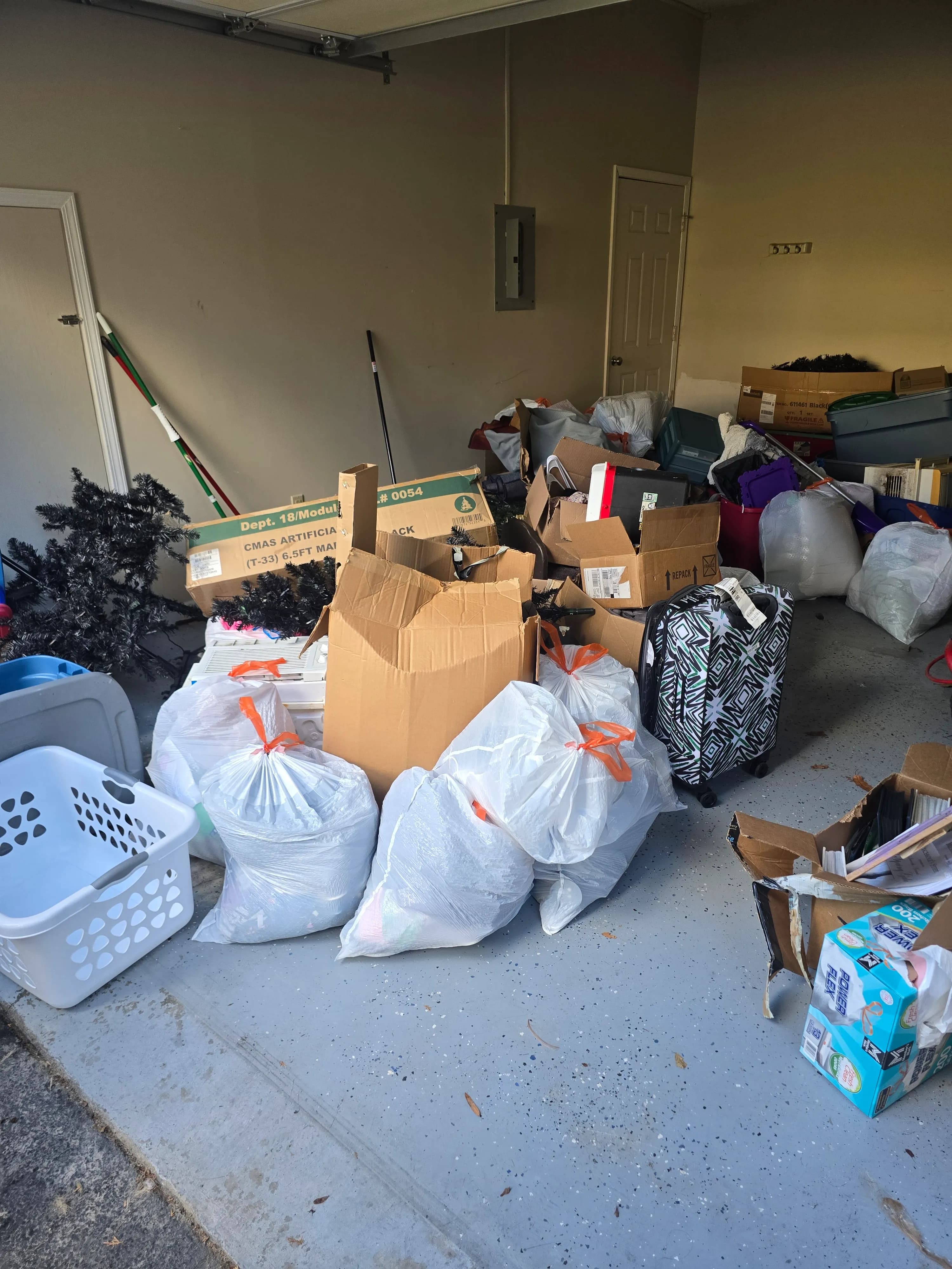 Garage clutter staged for cleanout by Kraken Junk Removal