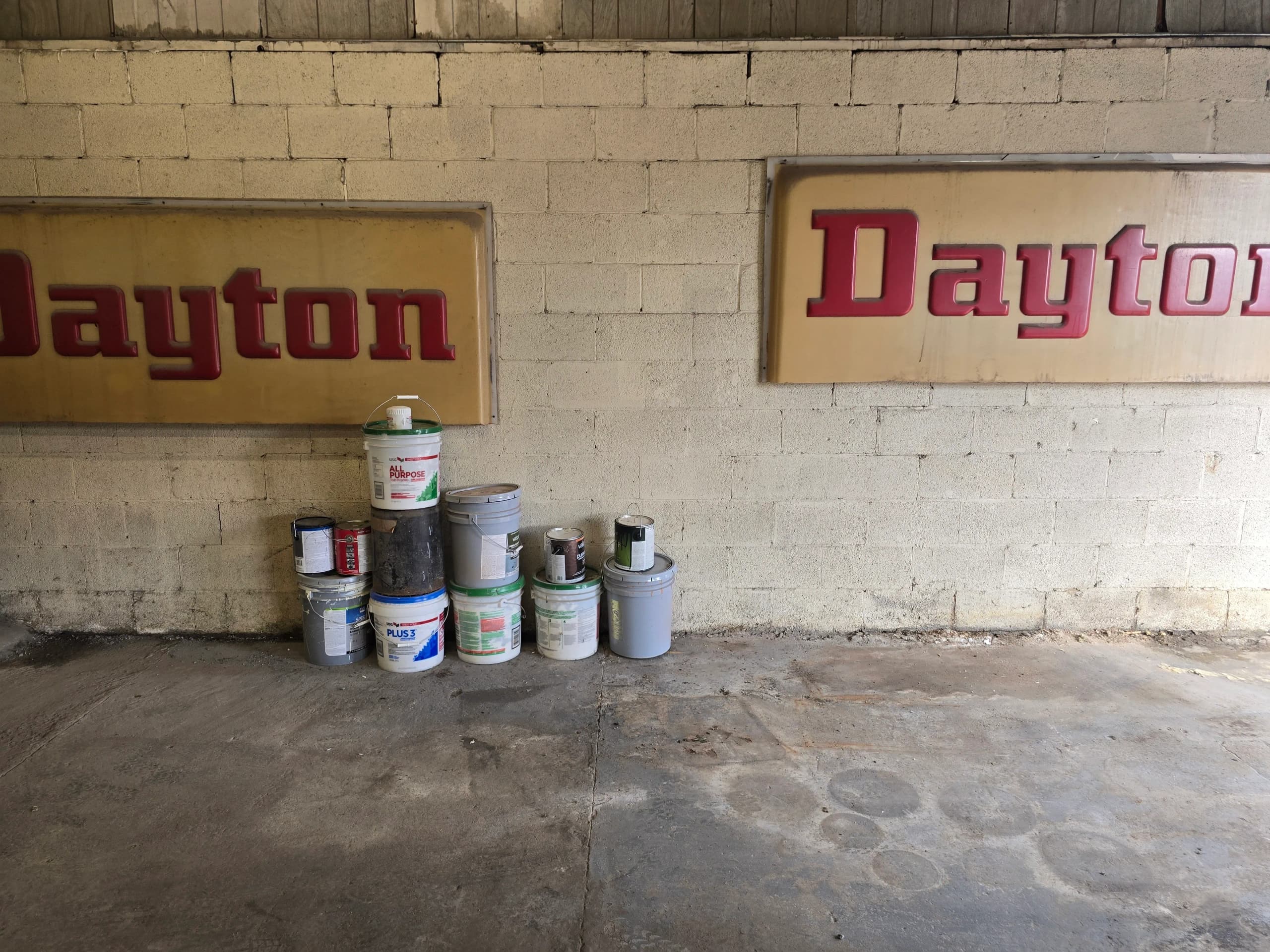 Cleared concrete floor after garage cleanout by Kraken Junk Removal