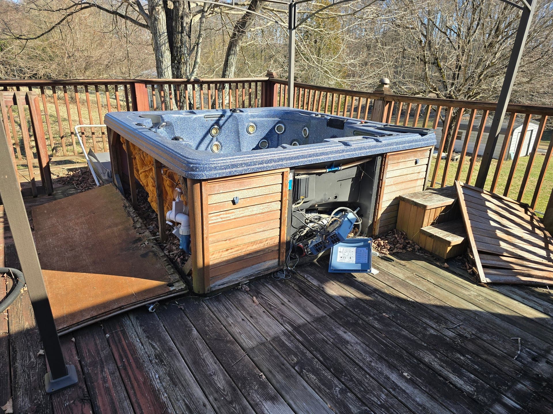 Hot tub on a wooden deck before removal in the Holston Valley area of Bristol, TN