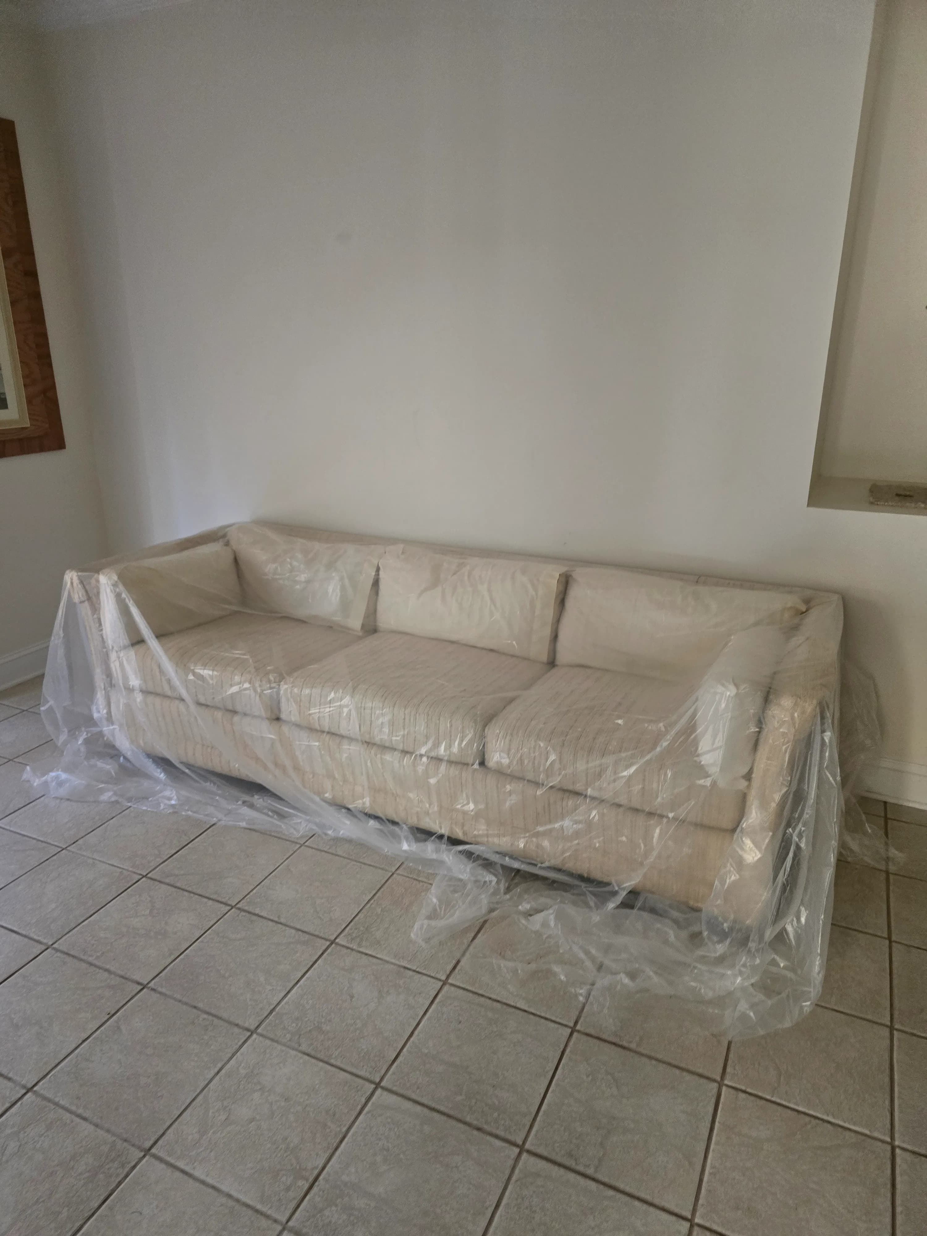 Old couch before furniture removal in Piney Flats, TN