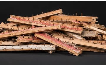 Pile of wooden carpet tack strips with exposed pins