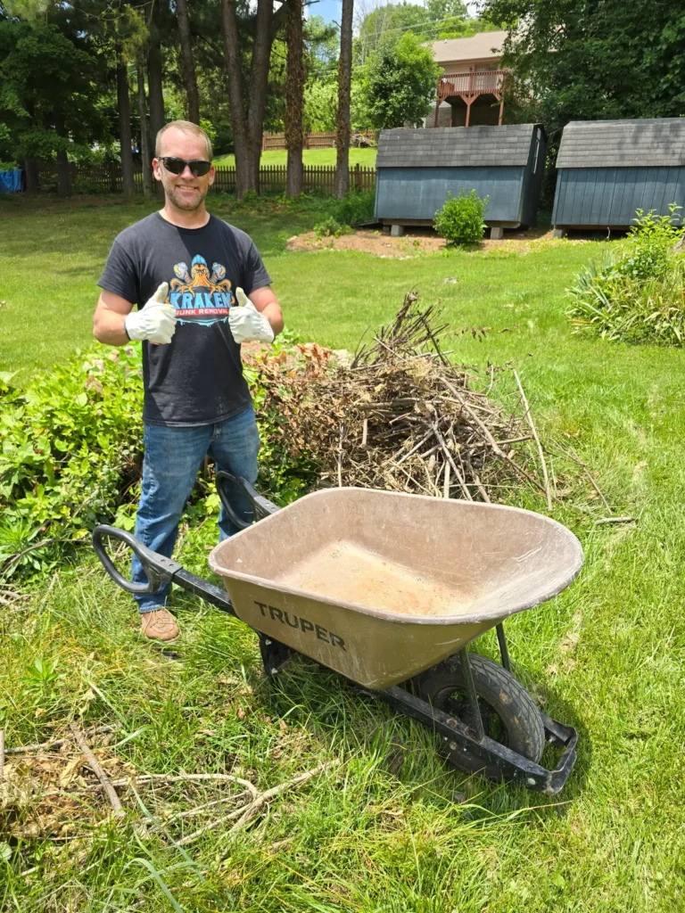 Kraken Junk Removal professional efficiently clearing yard debris in Tri-Cities, TN, demonstrating our eco-friendly and thorough service approach.