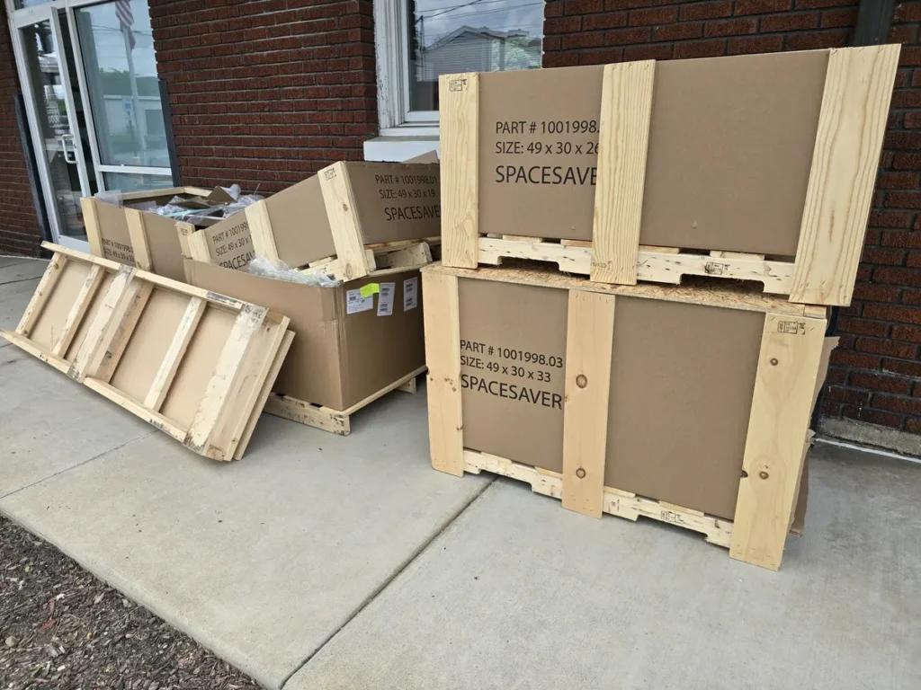 Kraken Junk Removal efficiently handling commercial waste removal in Tri-Cities, TN, with discarded packaging and wooden crates ready for disposal.