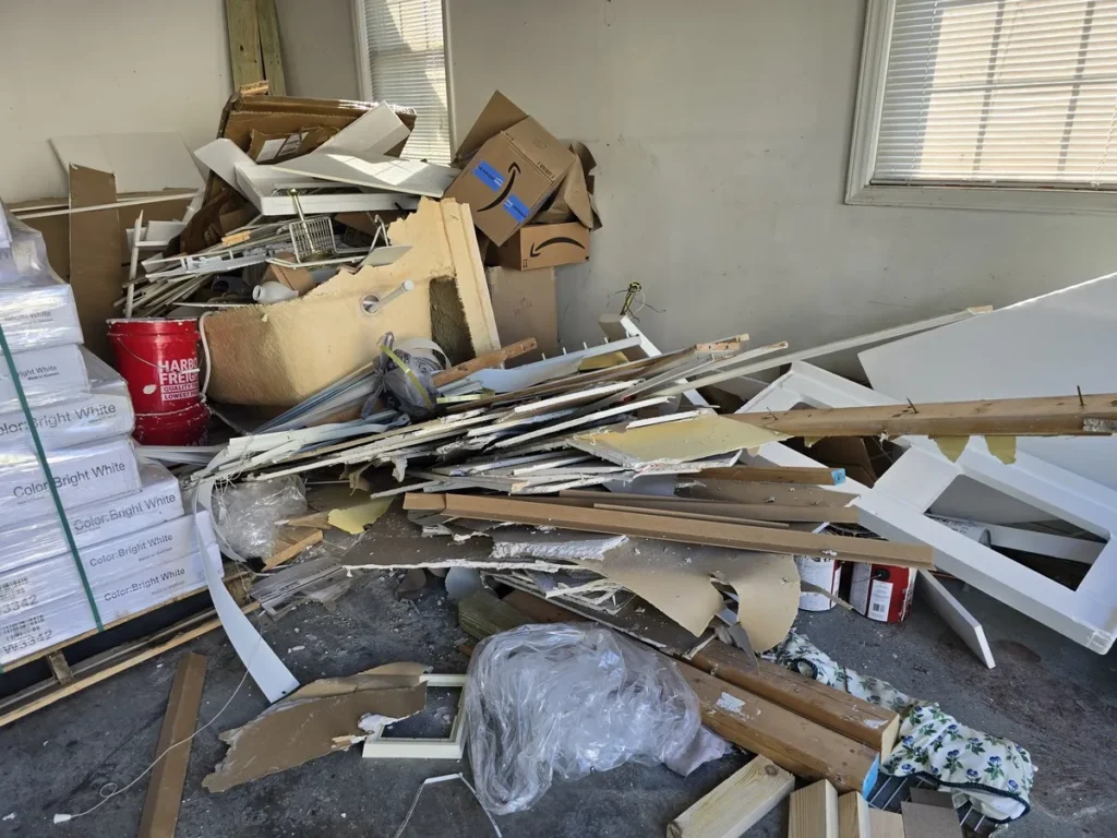 Kraken Junk Removal at work in Tri-Cities, TN, cleaning up a large pile of construction and disaster-related debris, ensuring a swift and thorough cleanup.