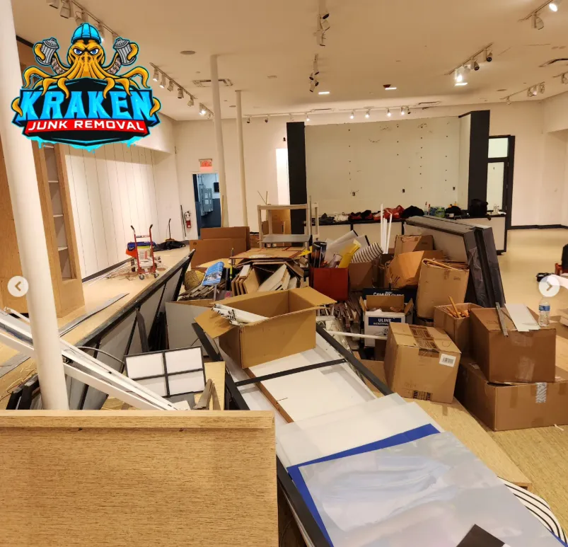 Commercial waste cleanup in Tri-Cities, TN by Kraken Junk Removal showing team efficiently clearing a store at the Johnson City Mall.